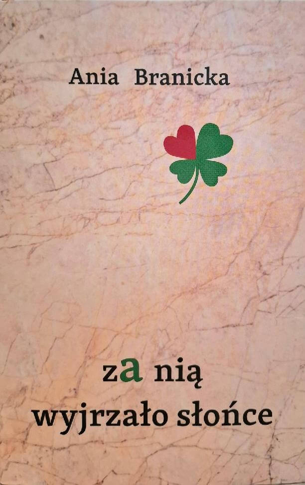 Okładka książki za nią wyjrzało słońce